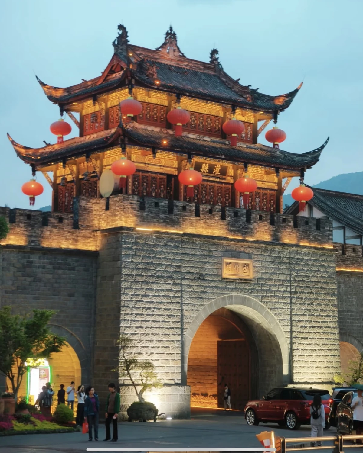Illuminated gate tower in Dujiangyan Ancient City